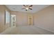 Spacious main bedroom with a ceiling fan, carpeted floors, and neutral paint at 4169 E Jasper Dr, Gilbert, AZ 85296