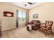 Cozy bedroom with window and comfortable seating; perfect for relaxation and unwinding at 42709 W King Fisher Dr, Maricopa, AZ 85138
