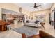 Bright open floor plan featuring the living room and kitchen, ideal for modern living and entertaining at 42709 W King Fisher Dr, Maricopa, AZ 85138