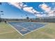 Inviting community tennis court for recreation and friendly competition under a bright sky at 42709 W King Fisher Dr, Maricopa, AZ 85138