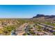 Aerial view of a beautiful community with well-maintained landscaping and amazing mountain views at 4297 S Pony Rider Trl, Gold Canyon, AZ 85118