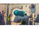 Bird's eye view of the backyard pool area, covered patio, and overall property layout at 4297 S Pony Rider Trl, Gold Canyon, AZ 85118