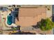 Aerial view showcasing the backyard pool, spa, and the layout of the single-story home at 4297 S Pony Rider Trl, Gold Canyon, AZ 85118