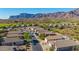 Overhead view of lush green trees surrounding lovely homes with views of mountain range at 4297 S Pony Rider Trl, Gold Canyon, AZ 85118