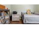Cozy bedroom featuring a comfortable bed, bookshelf, and a printer on a white desk at 4297 S Pony Rider Trl, Gold Canyon, AZ 85118