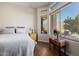 Bright bedroom with pool view from large window and wood look floors at 4297 S Pony Rider Trl, Gold Canyon, AZ 85118