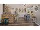 Inviting open-concept dining room with a rustic breakfast bar, wood-look floors, and modern lighting fixtures at 4297 S Pony Rider Trl, Gold Canyon, AZ 85118