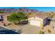 Charming single-story home with a well-maintained front yard and attached garage at 4297 S Pony Rider Trl, Gold Canyon, AZ 85118