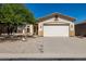 Charming single-story home with a two-car garage, desert landscaping, and neutral paint scheme at 4297 S Pony Rider Trl, Gold Canyon, AZ 85118