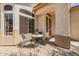 Welcoming front porch with a cozy seating area, perfect for enjoying the outdoors at 4297 S Pony Rider Trl, Gold Canyon, AZ 85118