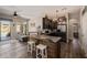 Modern kitchen featuring a rustic wood island with bar seating and stainless steel appliances, perfect for cooking and entertaining at 4297 S Pony Rider Trl, Gold Canyon, AZ 85118