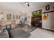 Open-concept living area with a built-in desk, dining area, and wood floors at 4297 S Pony Rider Trl, Gold Canyon, AZ 85118