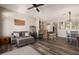 Open-concept living room with cozy seating, rustic wood bar, and a clear view of the dining area and kitchen at 4297 S Pony Rider Trl, Gold Canyon, AZ 85118