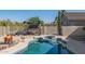 Refreshing pool and spa with a cabana for relaxing, set against a backdrop of desert landscaping at 4297 S Pony Rider Trl, Gold Canyon, AZ 85118