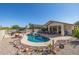 Sparkling pool and spa with a stylish cabana and desert-themed landscaping at 4297 S Pony Rider Trl, Gold Canyon, AZ 85118