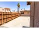 Wooden fence in a backyard with palm trees at 4625 W Thomas Rd # 50, Phoenix, AZ 85031