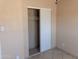 Spacious bedroom closet with sliding doors, rod, and neutral paint at 4625 W Thomas Rd # 50, Phoenix, AZ 85031