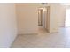 Bright hallway featuring tile floors and neutral paint creating an open atmosphere at 4625 W Thomas Rd # 50, Phoenix, AZ 85031