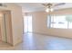 Inviting living room with neutral tones, tile flooring, and natural light from a large window at 4625 W Thomas Rd # 50, Phoenix, AZ 85031