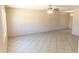 Bright, open living room featuring neutral-toned walls and tile flooring at 4625 W Thomas Rd # 50, Phoenix, AZ 85031