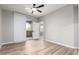 Bright bedroom with wood-look flooring and a sliding glass door leading to a balcony at 5303 N 7Th St # 326, Phoenix, AZ 85014