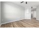 Spacious bedroom with neutral decor, wood floors, ceiling fan, and ample natural light at 5303 N 7Th St # 326, Phoenix, AZ 85014