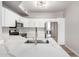 Modern kitchen with stainless steel appliances, white cabinets, white countertops, and an eat-in island sink at 5303 N 7Th St # 326, Phoenix, AZ 85014