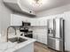 Modern kitchen featuring white cabinets, stainless steel appliances, and quartz countertops at 5303 N 7Th St # 326, Phoenix, AZ 85014