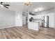 Open-concept layout seamlessly connecting the living area and modern kitchen with sleek countertops at 5303 N 7Th St # 326, Phoenix, AZ 85014