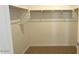 Bright walk-in closet with basic shelving and carpet at 5669 S 253Rd Ave, Buckeye, AZ 85326