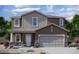 Charming two-story home with a two car garage, neutral color palette and beautifully landscaped front yard at 5828 W Coplen Farms Rd, Laveen, AZ 85339