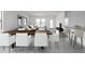 Open concept dining area with views of the living room and modern furnishings at 5836 W Coplen Farms Rd, Laveen, AZ 85339