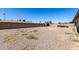 Backyard features gravel and block fencing at 617 E Calle Adobe Ln, Goodyear, AZ 85338