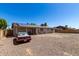 Backyard and exterior of the home, featuring solar panels at 617 E Calle Adobe Ln, Goodyear, AZ 85338