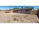 Exterior shot shows home with solar panels at 617 E Calle Adobe Ln, Goodyear, AZ 85338