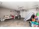 Garage space with a mattress propped against door at 617 E Calle Adobe Ln, Goodyear, AZ 85338