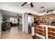 Open kitchen with stainless steel appliances, tile flooring, and a view into the living room at 617 E Calle Adobe Ln, Goodyear, AZ 85338