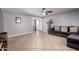 Spacious living room with neutral paint, tile floors, and a ceiling fan at 617 E Calle Adobe Ln, Goodyear, AZ 85338