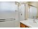 Bright shower features sliding glass door and adjustable shower head at 625 W Douglas Ave, Gilbert, AZ 85233