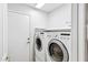 Clean laundry room with modern appliances and bright lighting at 625 W Douglas Ave, Gilbert, AZ 85233