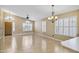 Bright living area with tile floors, plantation shutters, and a chandelier at 625 W Douglas Ave, Gilbert, AZ 85233