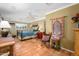 Comfortable bedroom with terra cotta tile floors, ceiling fan, and cozy decor at 6255 E Crocus Dr, Scottsdale, AZ 85254