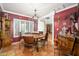 Warm dining room with shuttered windows, vintage decor, and rustic wood accents at 6255 E Crocus Dr, Scottsdale, AZ 85254