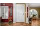 Stylish foyer featuring a white door, tiled floors, and artistic wall decor adding character at 6255 E Crocus Dr, Scottsdale, AZ 85254