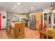 Spacious kitchen featuring tile flooring, an island, and modern appliances at 6255 E Crocus Dr, Scottsdale, AZ 85254