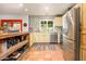 Bright kitchen with stainless steel appliances, tile backsplash, and wood countertops at 6255 E Crocus Dr, Scottsdale, AZ 85254