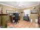 Cozy home office featuring terra cotta tile floors, neutral walls and natural light at 6255 E Crocus Dr, Scottsdale, AZ 85254