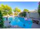 Inviting backyard pool surrounded by lush landscaping, offering a private outdoor oasis at 6255 E Crocus Dr, Scottsdale, AZ 85254