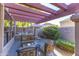 Seating area with partial outdoor kitchen with built in grill and granite countertop at 7525 E Gainey Ranch Rd # 164, Scottsdale, AZ 85258