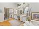 Spacious bathroom with double vanity, large mirror, tub, tile floor, and closet at 7525 E Gainey Ranch Rd # 164, Scottsdale, AZ 85258